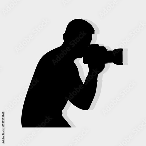 Photographer Silhouette Holding Camera – Professional Photography Vector Icon.