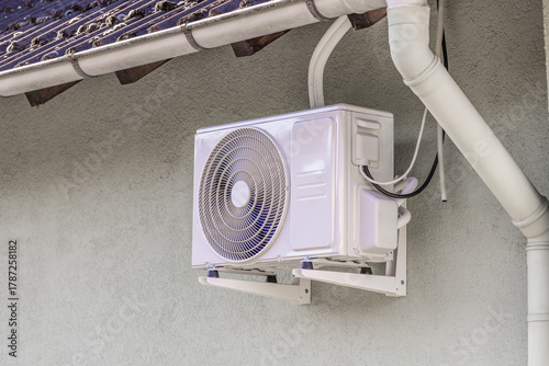 Inverter split system, heating and cooling pump installed under roof of family home