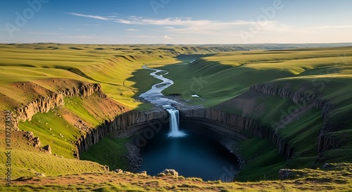 Serene Waterfall in a Green Canyon Landscape