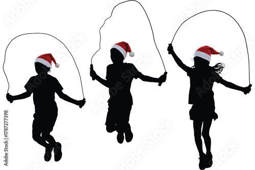 Children in silhouette wearing Santa hats jump rope, celebrating the holidays.