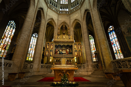 Kutná Hora, Czech Republic – August 8, 2025: Main altar with neo-Gothic Last Supper relief and ornate gilded reredos in chancel of St. Barbara’s Cathedral, Kutná Hora, UNESCO World Heritage Site