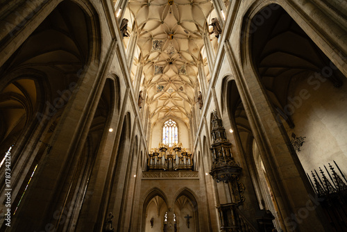 Kutná Hora, Czech Republic – August 8, 2025: Cathedral of St. Barbara interior featuring ornate Gothic vaulted ceiling and Baroque pipe organ, Kutná Hora