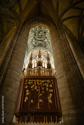 Kutná Hora, Czech Republic – August 8, 2025: Ornate rear side of main altar with gilded grapevine decoration and Gothic vaulted ceiling inside St. Barbara’s Cathedral, Kutná Hora