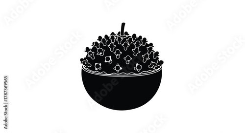 Bowl overflowing with freshly popped popcorn, perfect for a movie night snack.