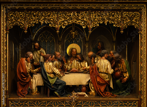 Kutná Hora, Czech Republic – August 8, 2025: Close-up of carved Last Supper altarpiece scene with golden decorative Gothic arches and figures, Cathedral of St. Barbara, Kutná Hora
