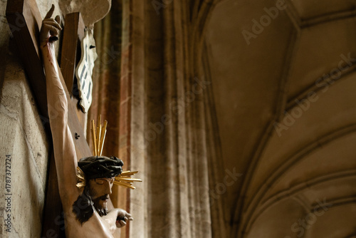 Kutná Hora, Czech Republic – August 8, 2025: Wooden crucifix sculpture of Jesus Christ with crown of thorns in side aisle of St. Barbara’s Cathedral, Kutná Hora, UNESCO World Heritage Site.
