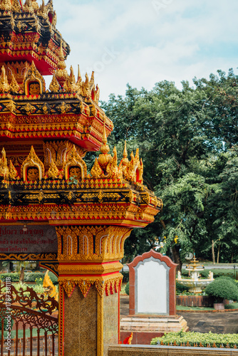 Ornate golden gate detail at Wat Chalong temple, Phuket
