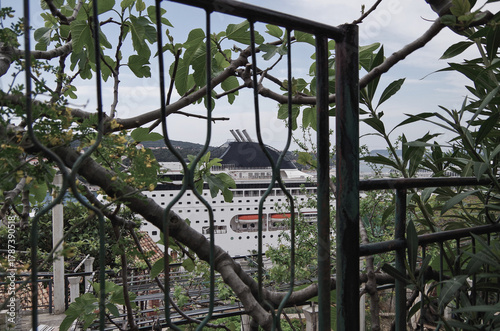 Italian family cruiseship cruise ship liner Lirica, Armonia or Sinfonia in port of Dubrovnik, Croatia during Summer Mediterranean cruising with harbor infrastructure marine traffic