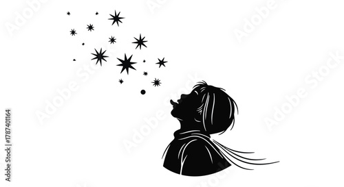 Young child blowing sparkling stars into the night sky with wonder and imagination