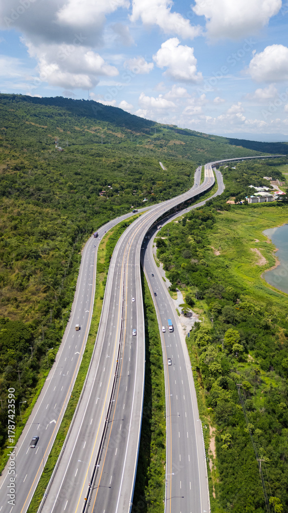 Obraz premium Drone shot The M6 motorway Nakhon Ratchasima Province - Bang Pa-in Lam Ta Khong River and Mountain. Motorway Korat Thailand