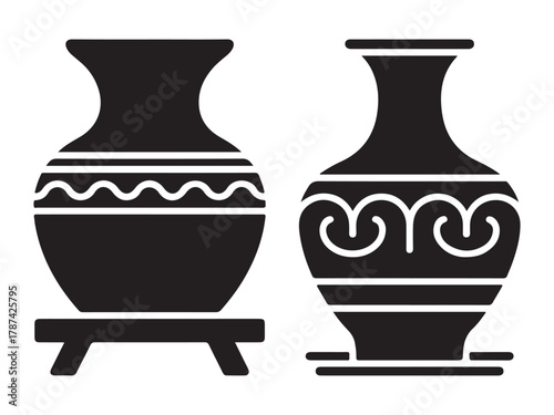 Two stylized black and white vases with decorative patterns, one on a stand.