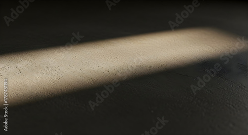 Dark grey concrete surface with soft window light and realistic shadow