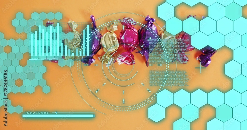 Fototapeta premium Displaying foil-wrapped candies shimmering in studio flat-lay on orange surface, with turquoise HUD