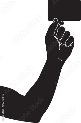 Silhouette of a fist holding a dark rectangular object high above