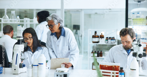 Photography Coworking, science or people with microscope in lab, blood sample analysis or experiment for pathology