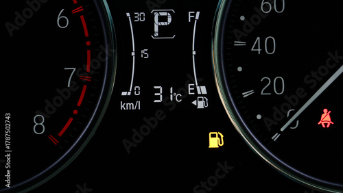 The icon of Oli Low Fuel Level Warning Light icon symbol on dashboard Car miles or Speed of meter with. transportation concept.