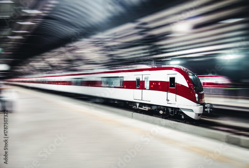 The electric train with motion blur Forward on rail tracks in the station with blank passenger. Speed train concept.