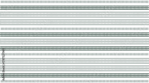 A repeating pattern of horizontal lines with dashes dots and zigzags on a white background surface