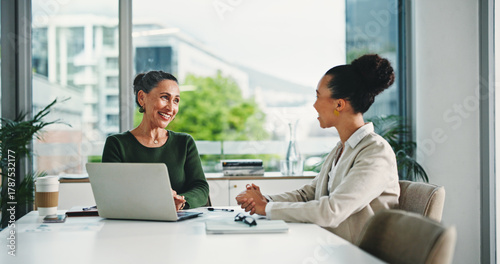 Photography Laptop, discussion and business women in office with feedback on corporate performance review