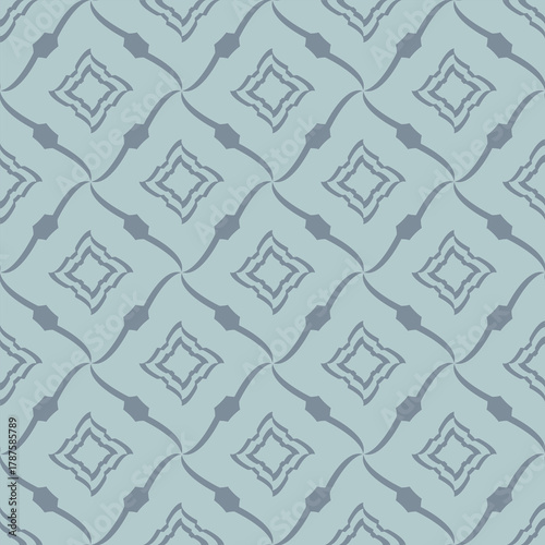 Geometric ornamental background in soft blue tones.