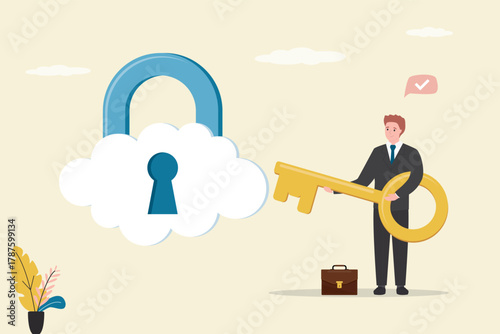 Smart businessman holds golden key from cloud with padlock. Cloud security system to protect information for remote work, secure technology for safety access online server