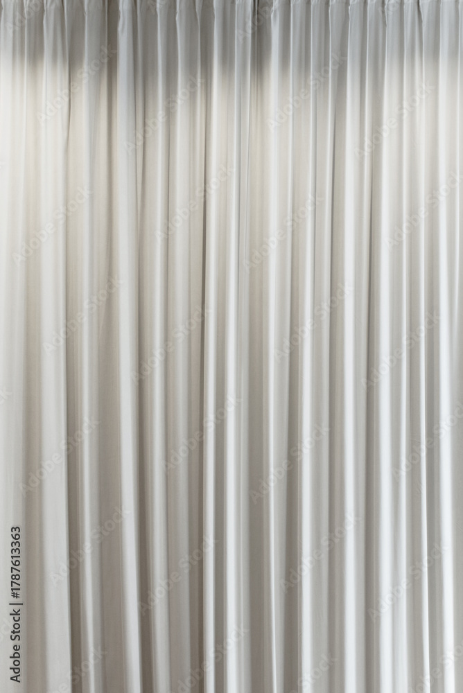 Obraz premium White vertical curtains, interior, theater curtain that dropped down as a straight line. Background for inserting text, empty spaces