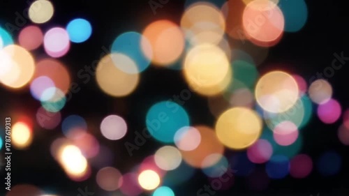 Shimmering multi colored festive bokeh light background loop