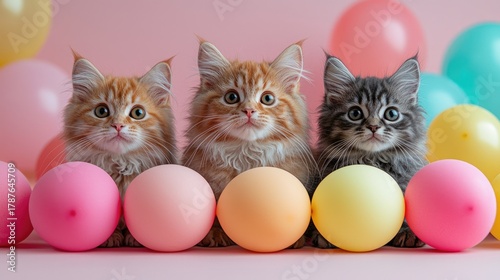 Cute Kittens Surrounded by Colorful Balloons on Pink Background