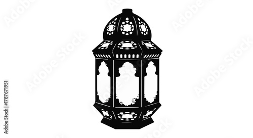 Intricate black lantern with ornate patterned cutouts, casting decorative light