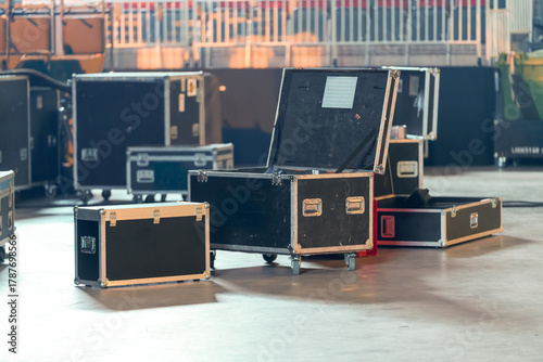 Industrial concert gear boxes with wheels, used for transporting and protecting equipment during event setup