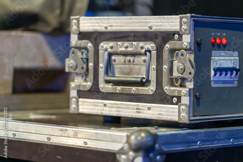 Industrial concert gear boxes with wheels, used for transporting and protecting equipment during event setup