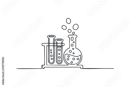 Laboratory glassware with bubbling liquid and bubbles