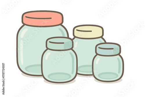 Four empty glass jars with colorful lids for kitchen storage