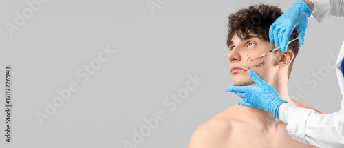 Young man receiving injecti...