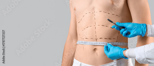 Plastic surgeon with scalpe...