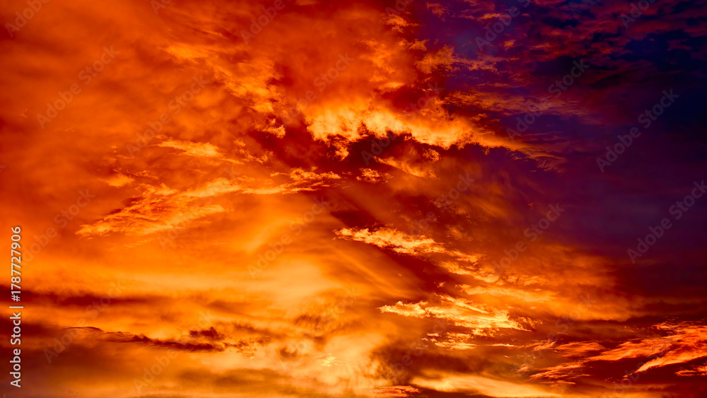Fototapeta premium Dark cloud in a sunset atmosphere.