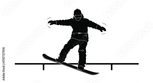 Snowboarder performs trick on rail in silhouette