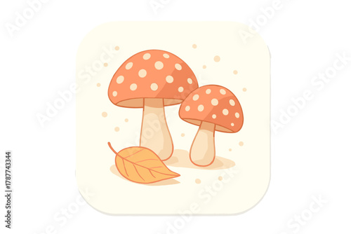 Two spotted toadstools beside a single autumn leaf