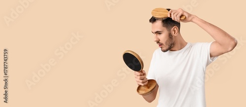 Young man with brush lookin...