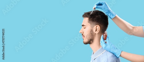 Trichologist applying serum...