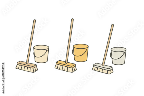 Assortment of household cleaning brooms and buckets with wooden handles
