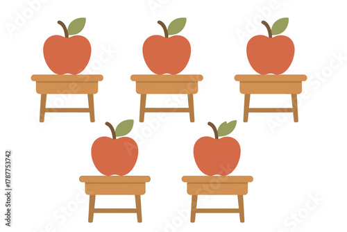 Pattern of red apples sitting on small wooden school desks