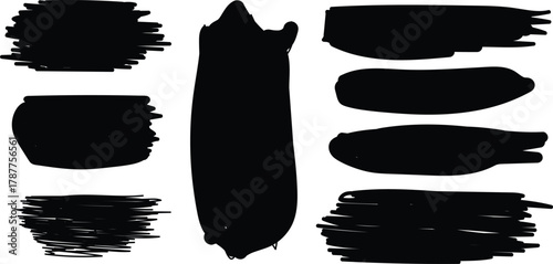 Collection of black paint brush strokes and smudges on a white background