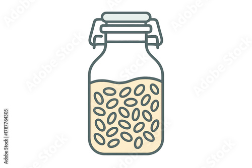 Glass jar with fermented soybeans or nuts submerged in liquid