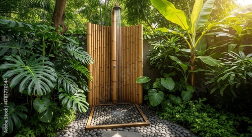Outdoor shower with bamboo screen surrounded by tropical plants and sunshine in the garden