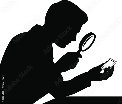 person examining a stamp with magnifier