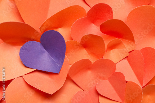 Purple paper heart among re...