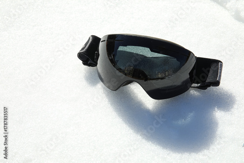 Ski goggles on white snow