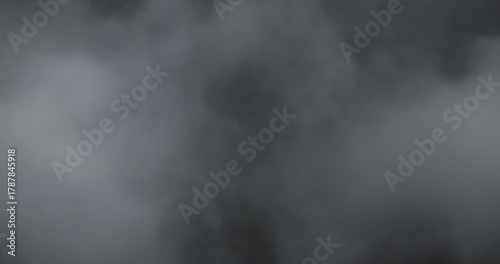 Artistic ethereal 4K slow-motion footage of swirling fog and soft drifting smoke clouds, evoking tranquil mystery, cinematic ambience, delicate vapor movement, and moody brume ideal for visual design.