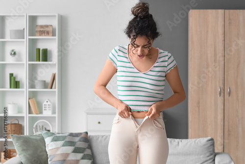 Upset African-American woma...